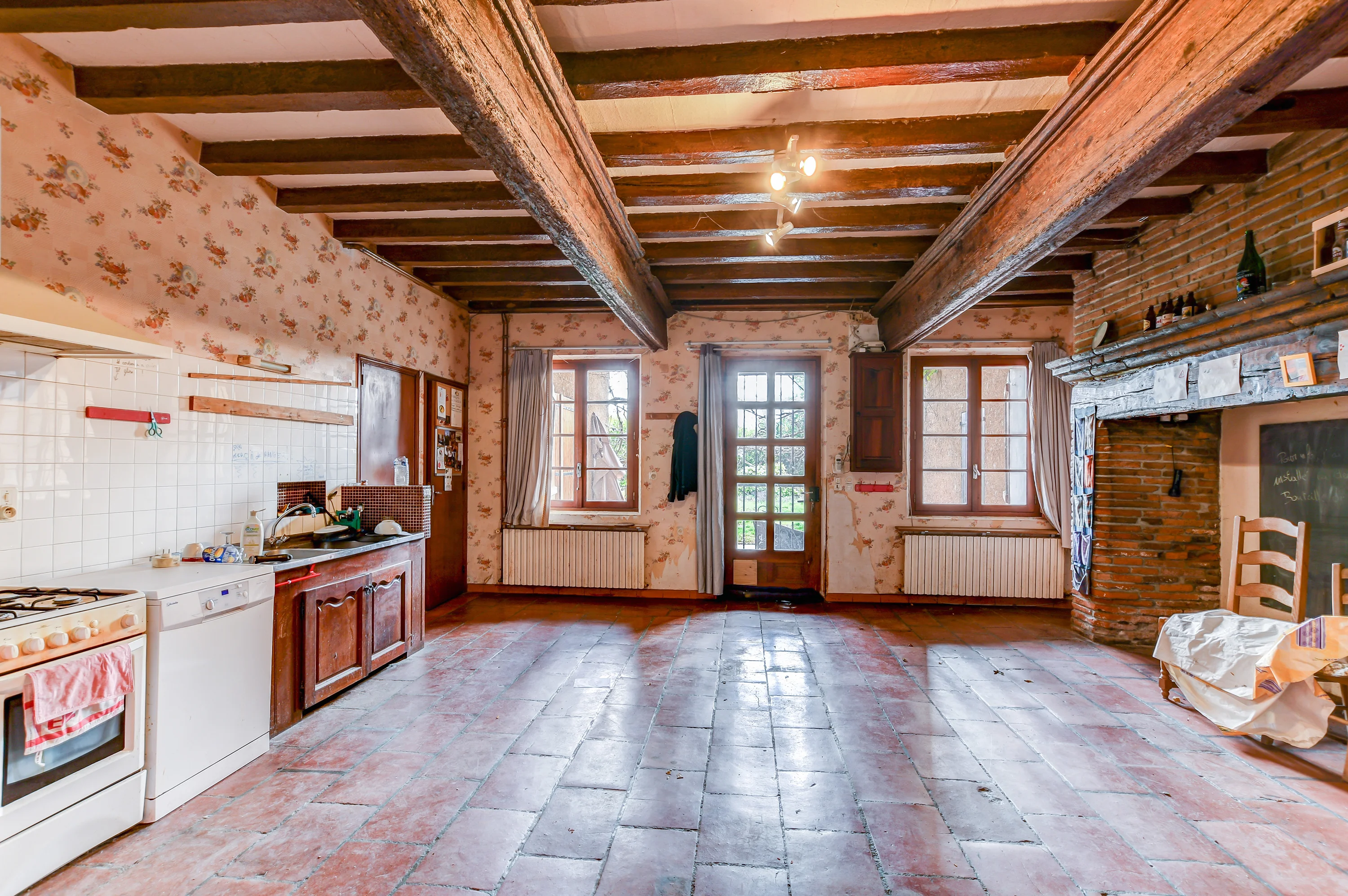 Outdated kitchen before renovation and professional editing, showing old appliances, worn cabinetry, and potential for modern upgrades in real estate or home improvement projects.